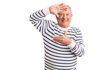 Sticker - Senior handsome grey-haired man wearing casual striped sweater smiling making frame with hands and fingers with happy face. creativity and photography concept.