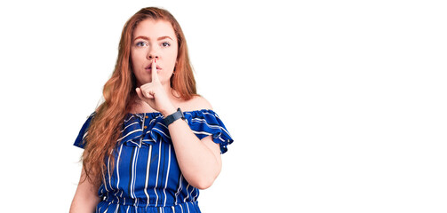 Sticker - Young beautiful redhead woman wearing casual clothes asking to be quiet with finger on lips. silence and secret concept.