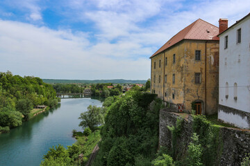 Canvas Print - Slunj/ Croatia-August 8th, 2018: Beautiful old castle, towering above Korana river, surrounded by green forest near the city of Karlovac