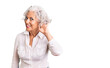 © Krakenimages.com - Senior grey-haired woman wearing casual clothes smiling with hand over ear listening an hearing to rumor or gossip. deafness concept.