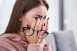Leinwandbild Motiv Woman rubbing dry irritated eyes