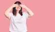 © Krakenimages.com - Young plus size woman wearing casual clothes covering eyes with hands smiling cheerful and funny. blind concept.