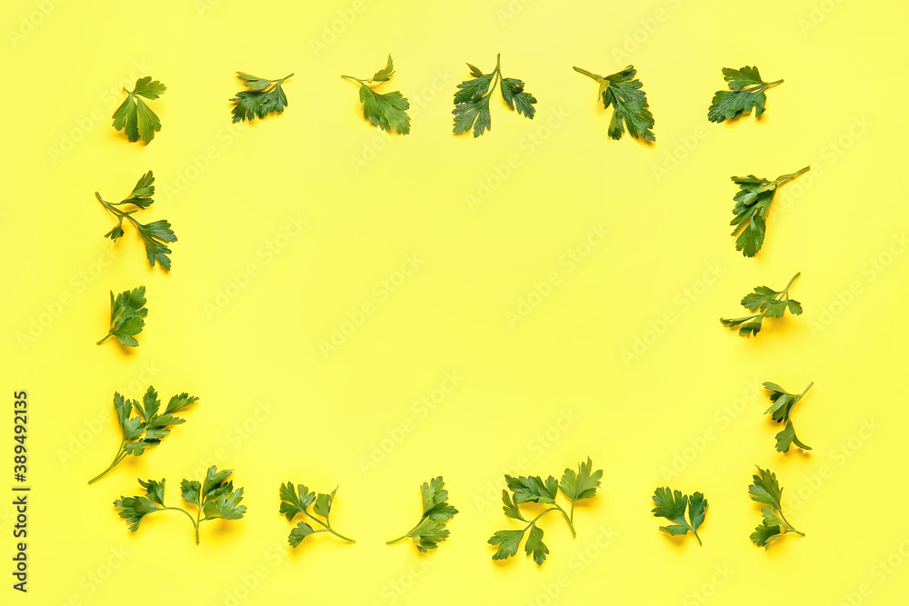 Frame made of fresh parsley on color background