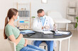 © Pixel-Shot - Pregnant diabetic woman visiting doctor in clinic