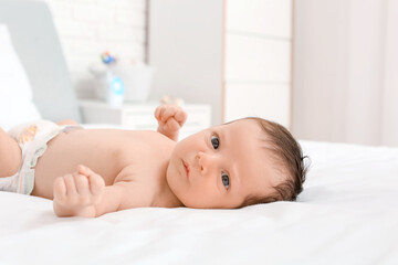 Sticker - Cute little baby lying on bed at home