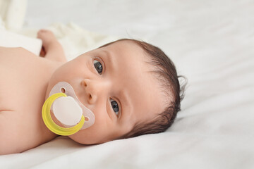 Sticker - Cute little baby lying on bed