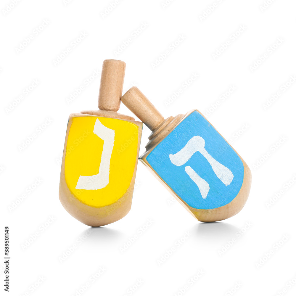 Dreidels for Hanukkah on white background