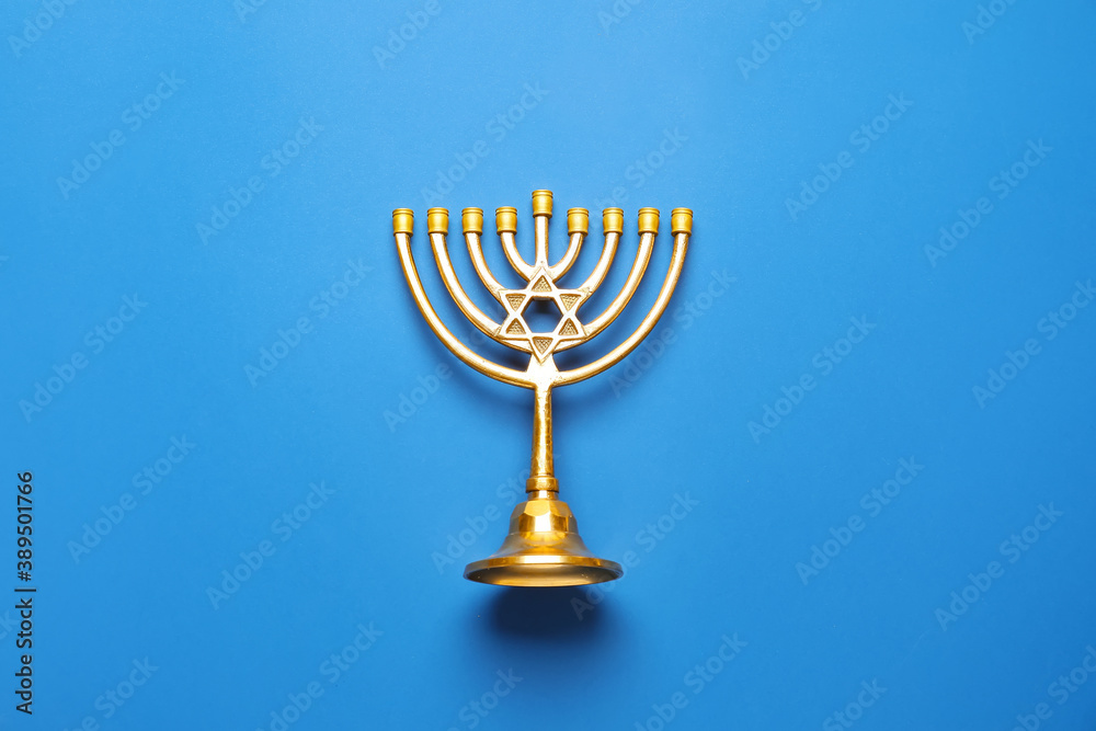 Menorah for Hanukkah on color background