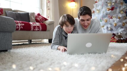 Canvas Print - Two Brothers Using Laptop at Christmas Time
