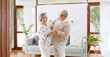 © Nattakorn - Asian senior couple enjoy dancing to relax at home, senior retirement lifestyle concept