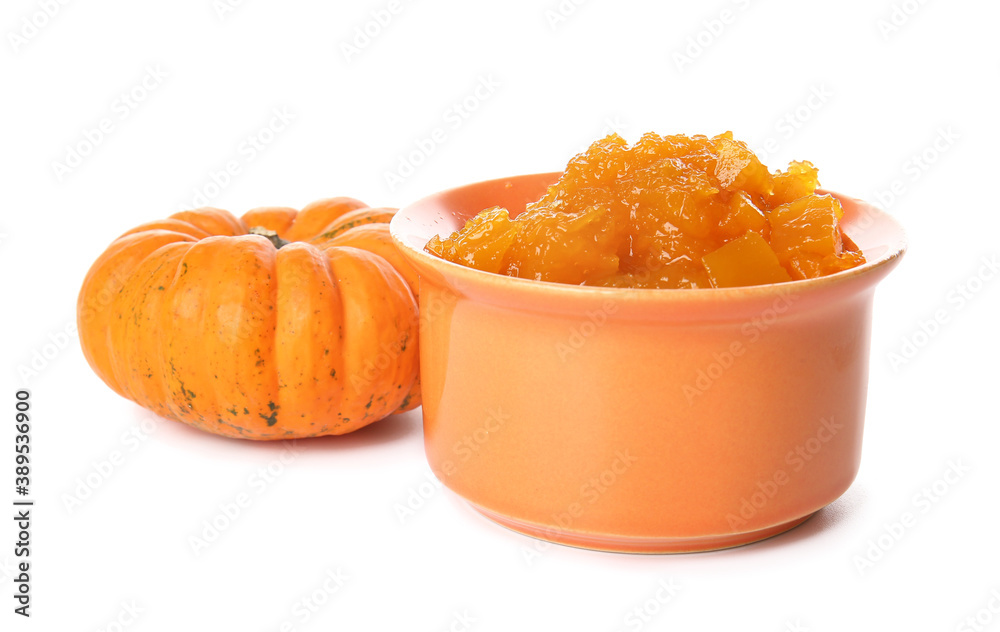 Bowl of tasty pumpkin jam on white background