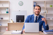 © Elnur - Young male businessman employee working in the office