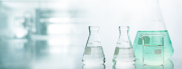 Wall Mural - flask and beaker in chemistry science laboratory banner background