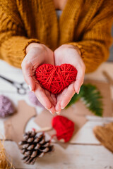 Woollen heart made from cardboard 