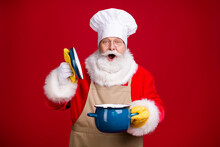 Photo Of Astonished Santa Claus Open Saucepan Pot Cover X-mas Tradition Dinner Cooking Wear Chef Cap Red Costume Apron Isolated Bright Shine Color Background