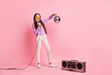 Full Length Photo Of Little Kid Girl Sing Song Mic Hold Disco Ball With Boom Box Isolated Over Pastel Color Background