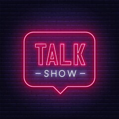 Talk show neon sign on brick wall background .