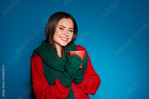 Portrait of her she nice attractive pretty cheerful cheery girl wearing wool knitted garment enjoying drinking tasty latte pause break rest isolated bright vivid shine vibrant blue color background