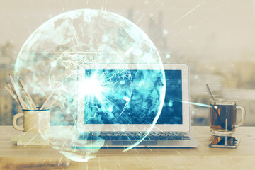 Multi exposure of business theme icons and work space with computer background. Concept of success.