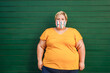 © DisobeyArt - Happy plus size woman wearing a face protective mask during coronavirus outbreak - Focus on face