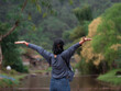 © khamkula - Young Asian women breathe the fresh air on the mountain top.
