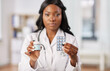 medicine, people and healthcare concept - african american female doctor or nurse with drugs at hospital