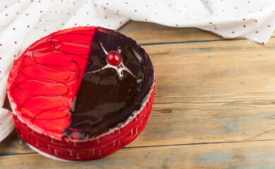 Poster - delicious cake with cherries and chocolate cream on wood table