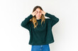 © Asier - Young caucasian woman isolated on white background having a head ache, touching front of the face.