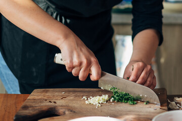 Canvas Print - Close up shot of a chef chopping parsley