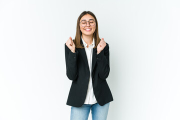 young caucasian business woman raising fist, feeling happy and successful. victory concept.