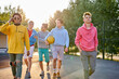© alfa27 - energetic, healthy teens have fun, talk before playing basketball, group of happy teenage boys in colourful casual wear, playing basketball outdoors in the city, go at playground