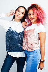 Wall Mural - best friends diverse races teenage girls together having fun, asian and african , posing emotional on white background, lifestyle people concept