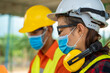 © visoot - Construction workers wear protective face masks to prevent the spread of Covid 19 by wearing a face mask,Corona virus disease.