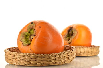 Ripe juicy organic persimmon, close-up, on a white background.