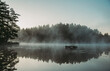 © Cavan Images - Mist rising off of a lake in the morning in Ontario, Canada.