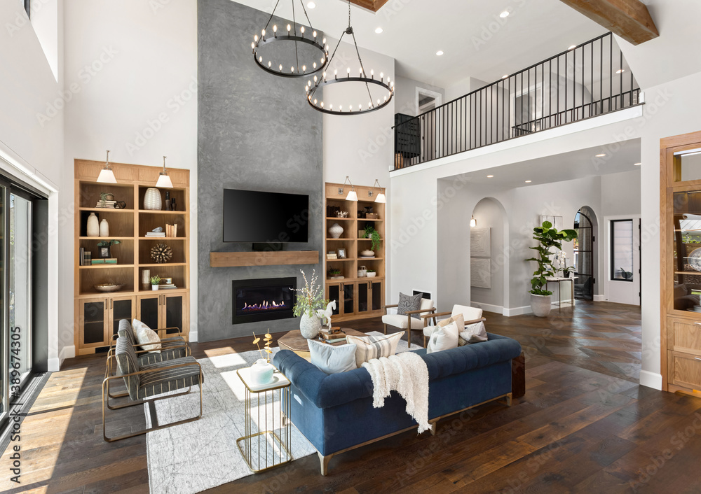 Living room in new luxury home with floor to ceiling fireplace s Stock ...