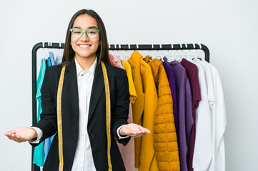 Wall Mural - Young asian designer woman isolated on white background showing a welcome expression.