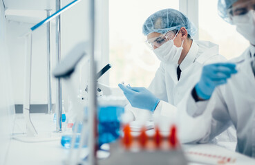 close up. group of scientists sitting at a laboratory table.