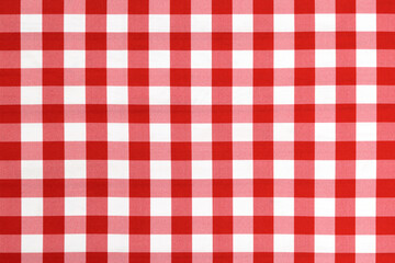 Red checkered textile picnic tablecloth pattern in close-up. Classic italian cuisine style.