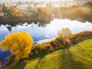 Wall Mural - Autumnal Sunrise Over Tarnow City in Poland. Kantoria Lake and Urban Skyline. Drone View
