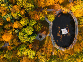 Wall Mural - Colorful Park Trees Foliage at Autumn Season. top Down Drone View. Strzelecki Park in Tarnow, Poland
