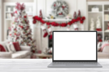 Wall Mural - Blank display screen laptop computer on white wood table. Modern cozy comfortable home living room with Christmas decor. Home office desk workspace. Mock up copy space. Winter sales, online shopping