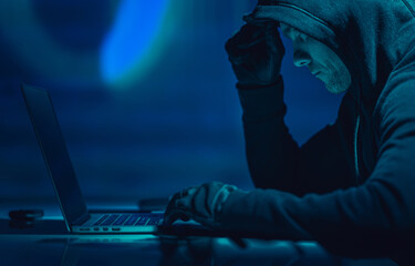 hacker in front of his laptop computer