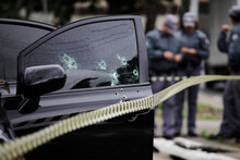 Bullet Holes Are Seen In The Window Of A Car After A Armed Robbery Shot In Sao Paulo, Brazil.