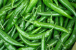 © Andrii - background of green chili peppers