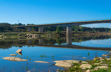 Road bridge over a shallow river