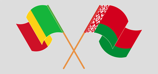 Crossed and waving flags of Mali and Belarus