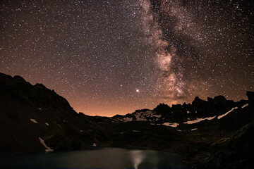 colorfull night landscape wtih star sky. astrophotography in Alps mountains