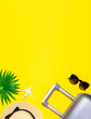 Leinwandbild Motiv Beach background. Womens accessories traveler: suitcase, white plane, sunglasses on yellow background with empty space for text. Design of summer vacation holiday concept.