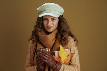 smiling elegant housewife in scarf against bronze background